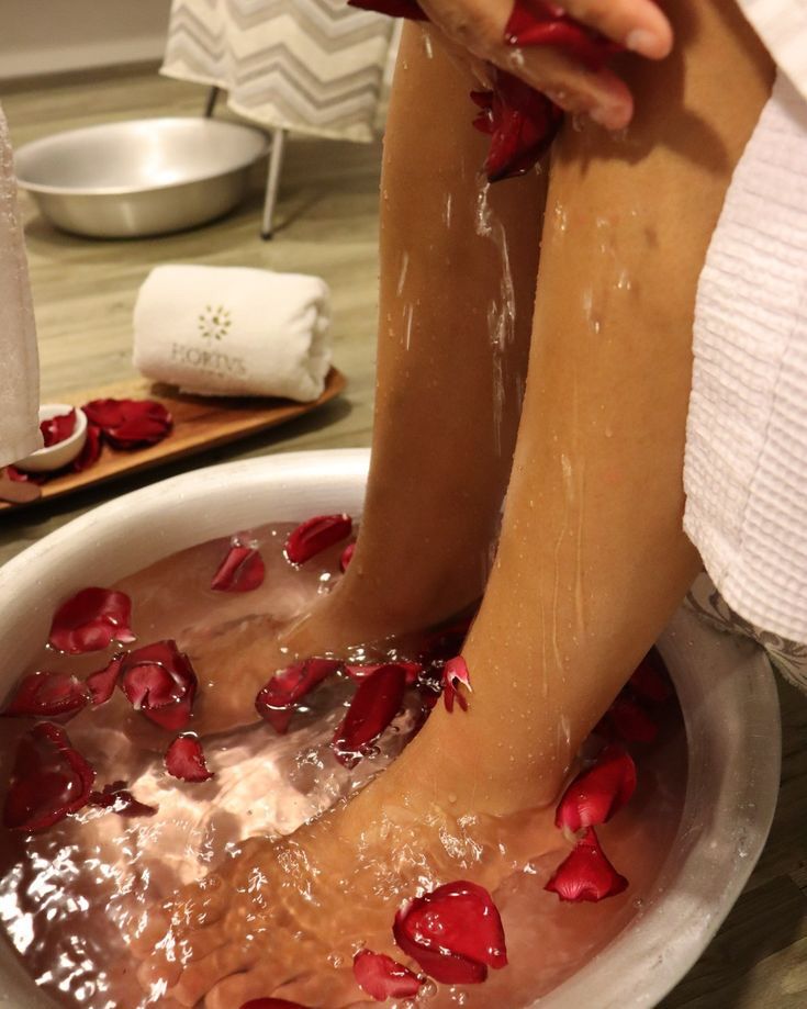Foot bath ritual with rose petals